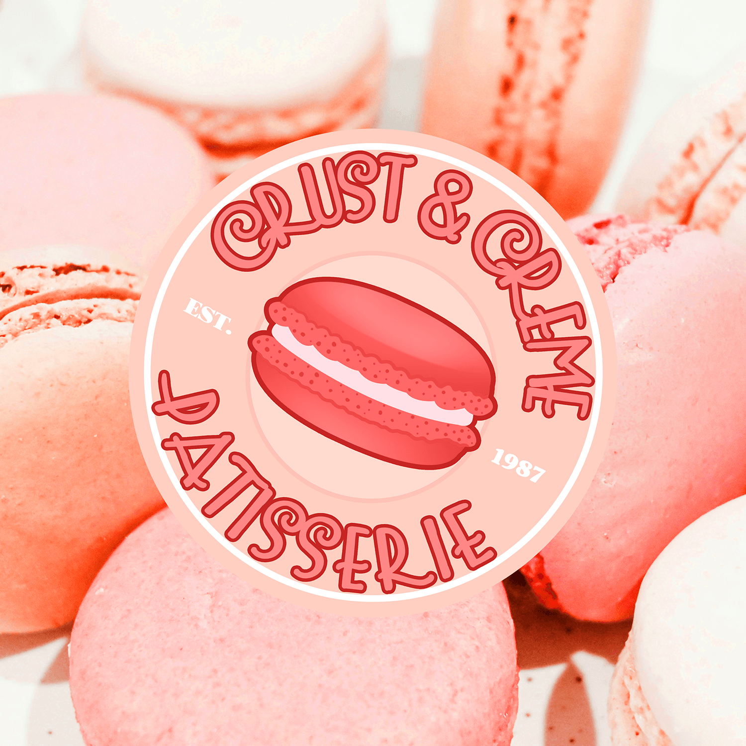 A pink logo featuring a macaron in an Art Nouveau style for Crust & Creme Patisserie.