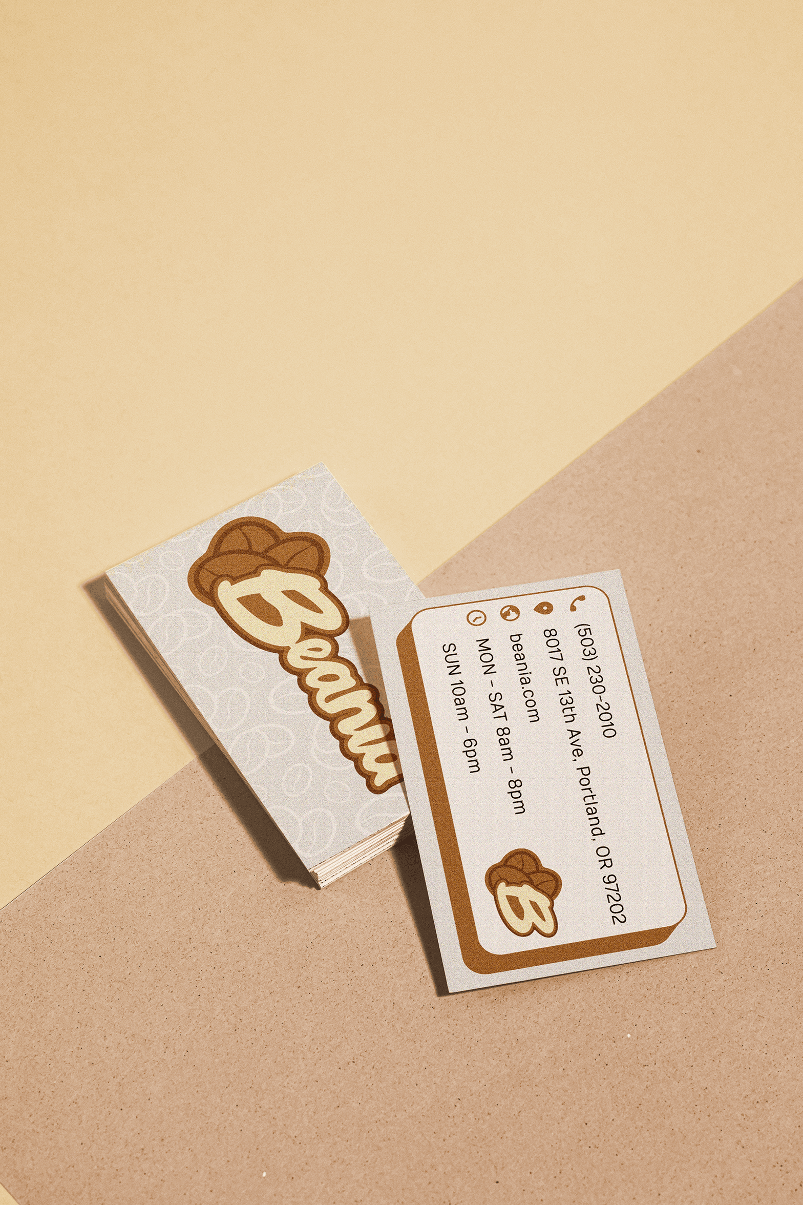 Photo of business cards for Beania. Visual overview of Beania Coffee Shop's brand style guidelines and branding kit, including logo, color palette, and design elements.